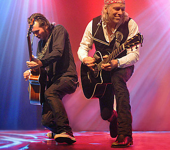 Elliott on stage with his guitarist, Olivier Durand