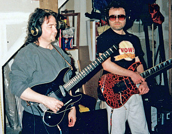 Buck and Bloom in Bob Rivers' garage, where they recorded some <a href="https://www.songfacts.com/blog/interviews/bob-rivers-twisted-tunes" target="_blank">Twisted Tunes</a>