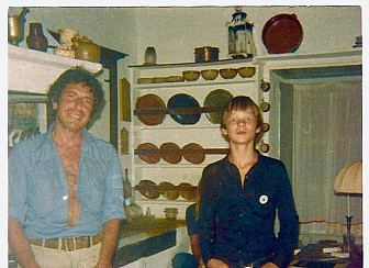 Leonard Cohen with Marianne's son, Axel, in Leonard's kitchen on Hydra in 1973