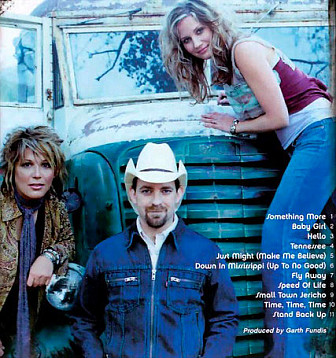 Kristen Hall with Sugarland on the back cover of the <i>Twice The Speed Of Life</i> album