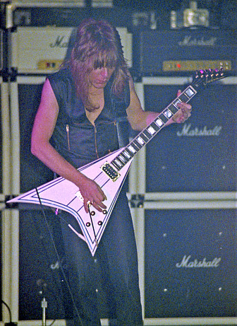 Randy Rhoads with his offset Flying V. Photo by Bill O'Leary. Check out <a href="https://www.songfacts.com/blog/writing/rock-photos-from-golden-age-of-concert-photography" target="_blank">more of his rock photos</a>.