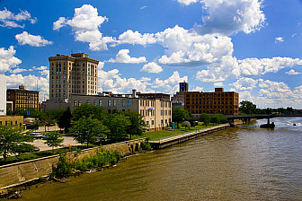 Downtown Saginaw along the Saginaw River<br>Photo: <a href="https://commons.wikimedia.org/wiki/File:%22Place_of_the_Sauk%22.jpg">Dhacim</a>, <a href="https://creativecommons.org/licenses/by-sa/3.0">CC BY-SA 3.0</a>, via Wikimedia Commons
