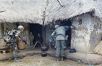Soldiers inspecting Village in Vietnam<br>Photo: National Archives